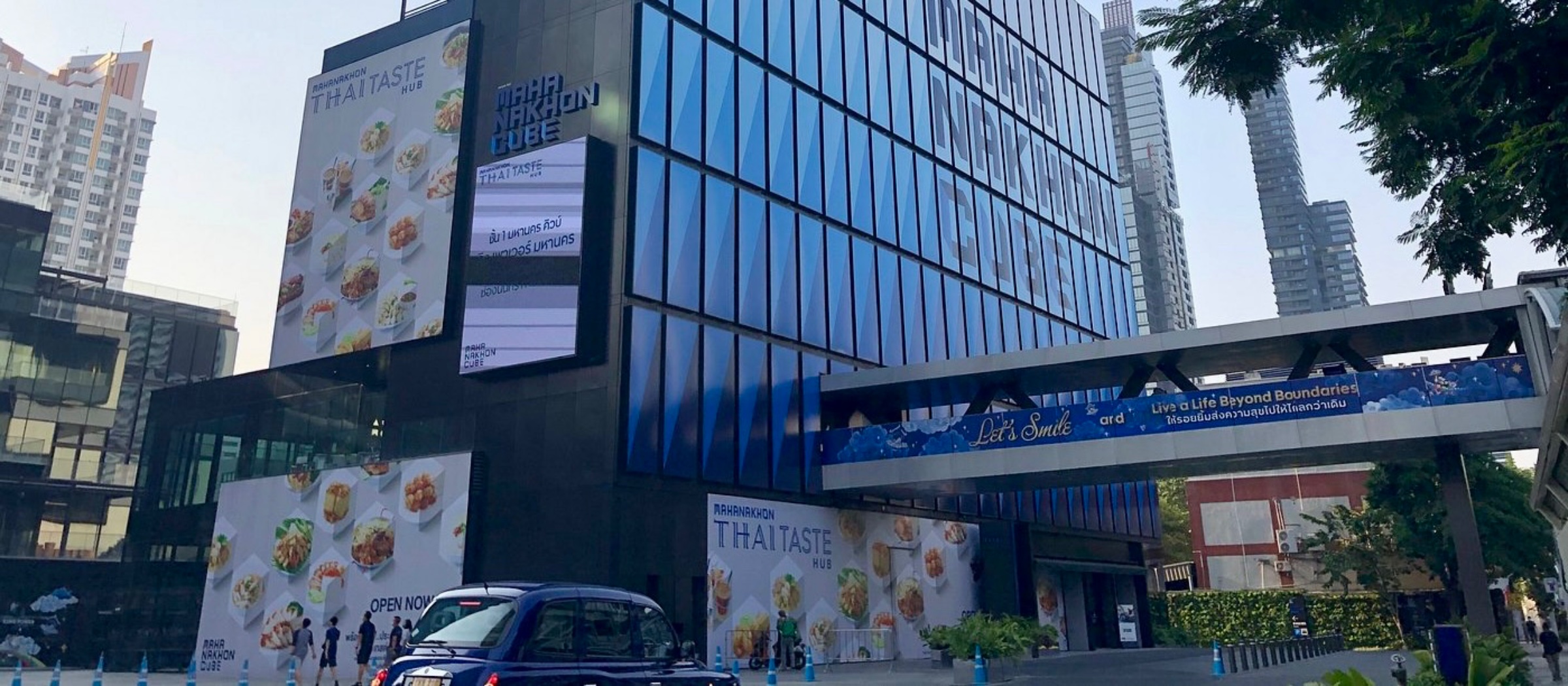 Mahanakhon CUBE building exterior at golden hour — RM58 Pilates location